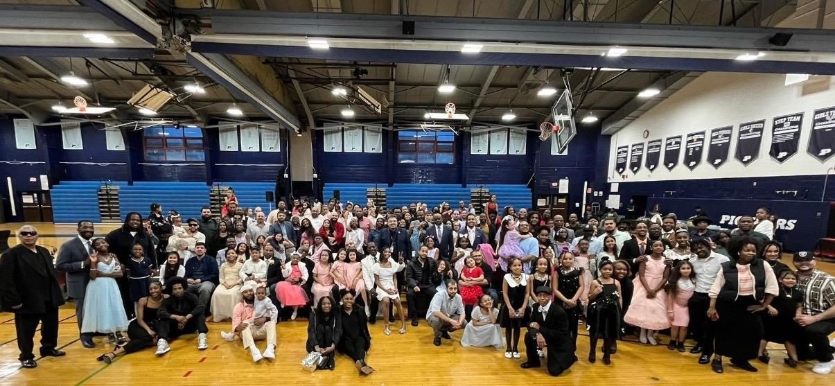  Hundreds pose for a photo in Poughkeepsie High School's gymnasium.